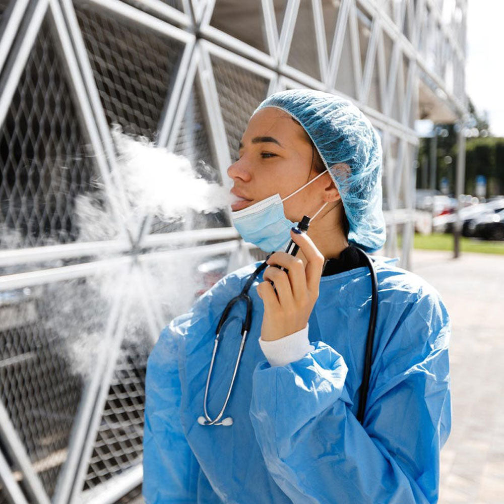 Medical personnel vaping while wearing a mask