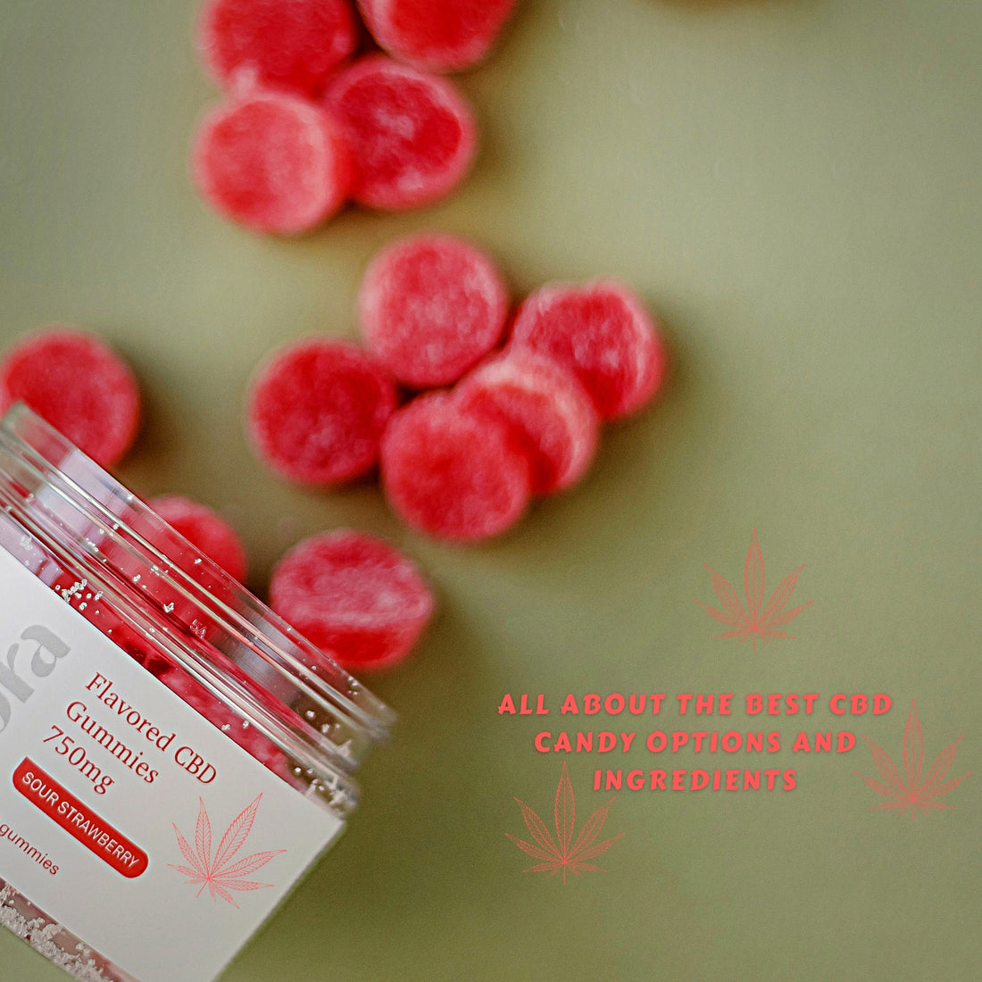 Sour strawberry flavored CBD gummies with container close up scattered on table