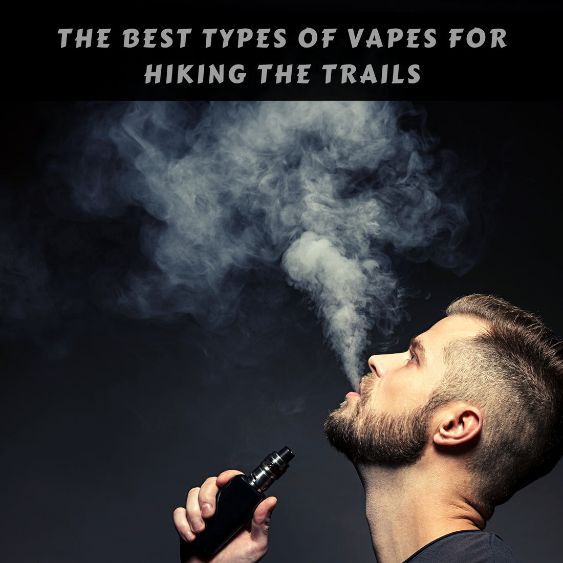 Man holding box mod vape blowing vapors upwards