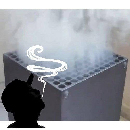 Silhouette of Man Blowing Smoke Into Xbox